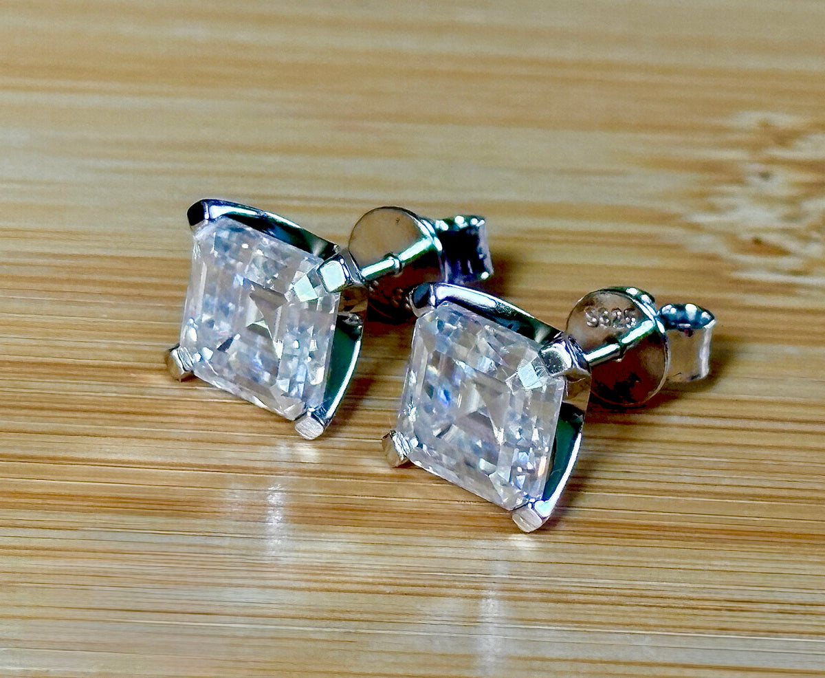 Moissanite studs. A 6.4ctw *perfect* pair of DOUBLE certified Asscher-cut Moissanites in my custom 4-claw 935 ARGENTIUM silver mountings! Opulent!