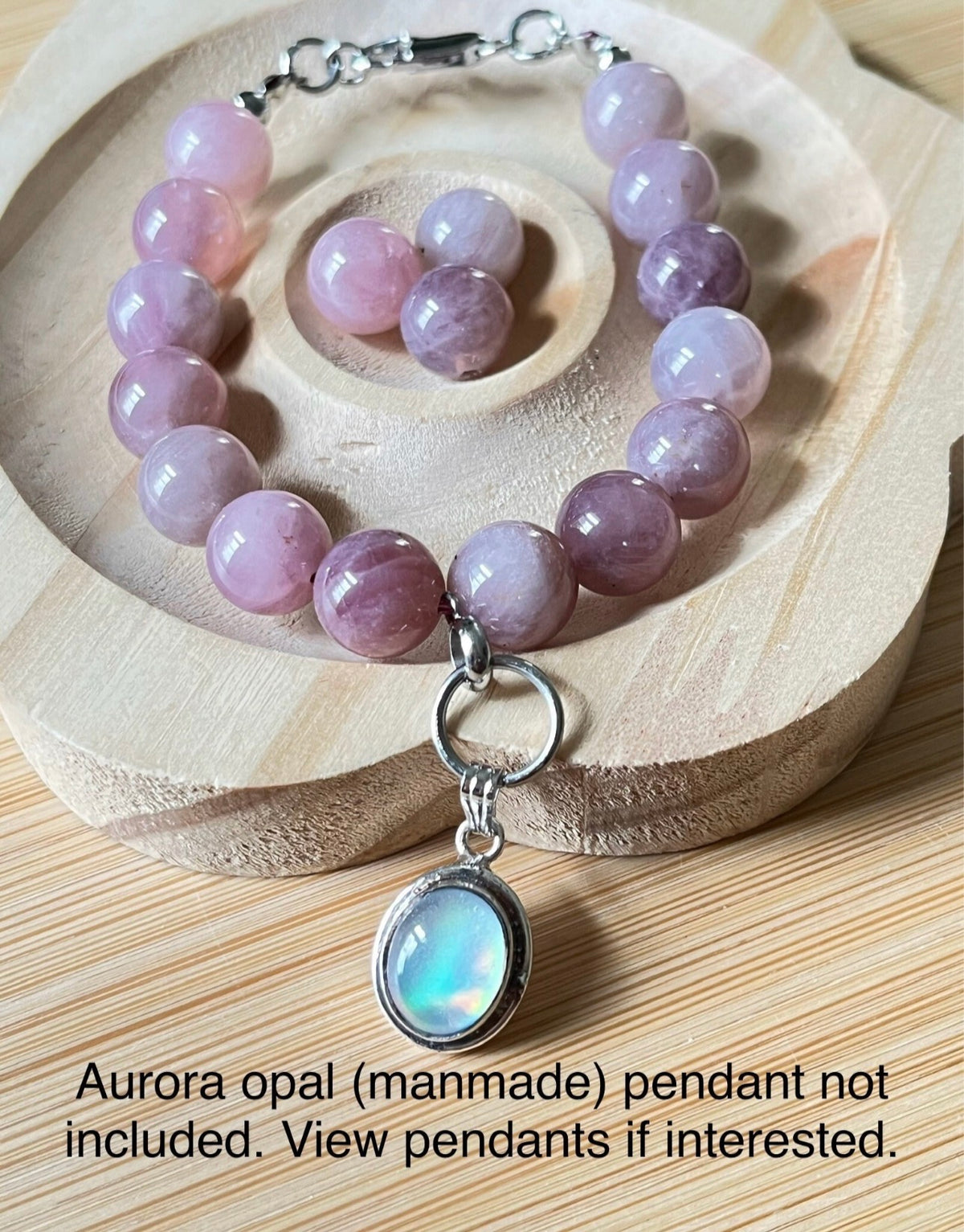 Madagascar rose quartz bracelet. Hands-down GORGEOUS AAA-grade 10.5mm purple-pink rose quartz beads and with varying degrees of crystallization and color!