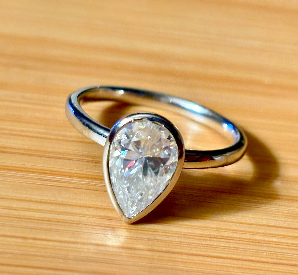 Moissanite ring. A certified 3ct pear in a hybrid basket + bezel of 925 sterling or 935 Argentium silver! A Hand Knotted Jewelry EXCLUSIVE!