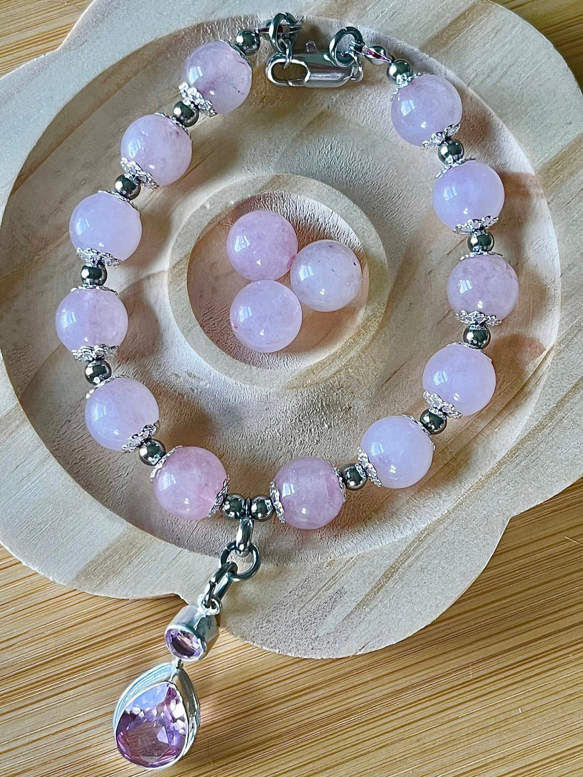 Rose quartz bracelet with 10mm Brazilian rose quartz beads and durable stainless steel components! The morganite pendant is optional.