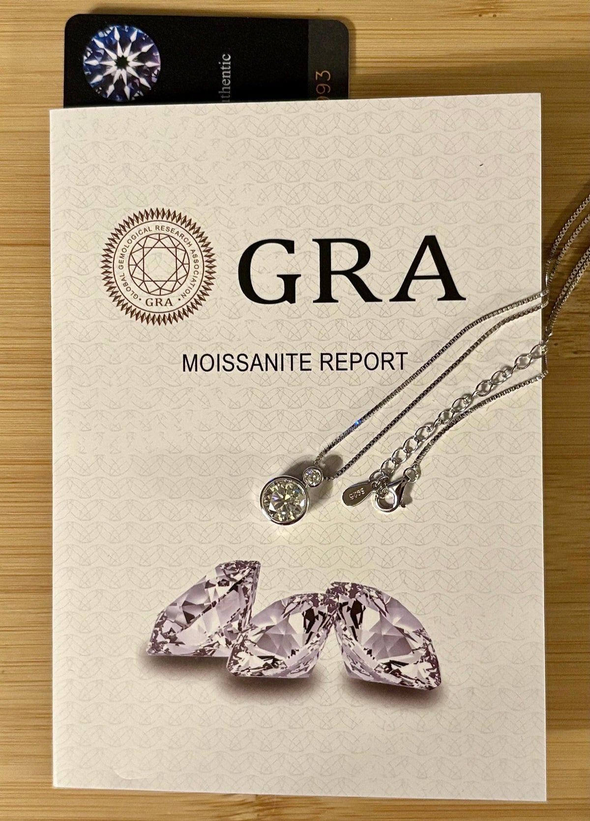 Moissanite necklace. A bright 2.1ctw certified Moissanite bezel pendant, with a 18” box chain and lobster claw clasp in sterling silver!