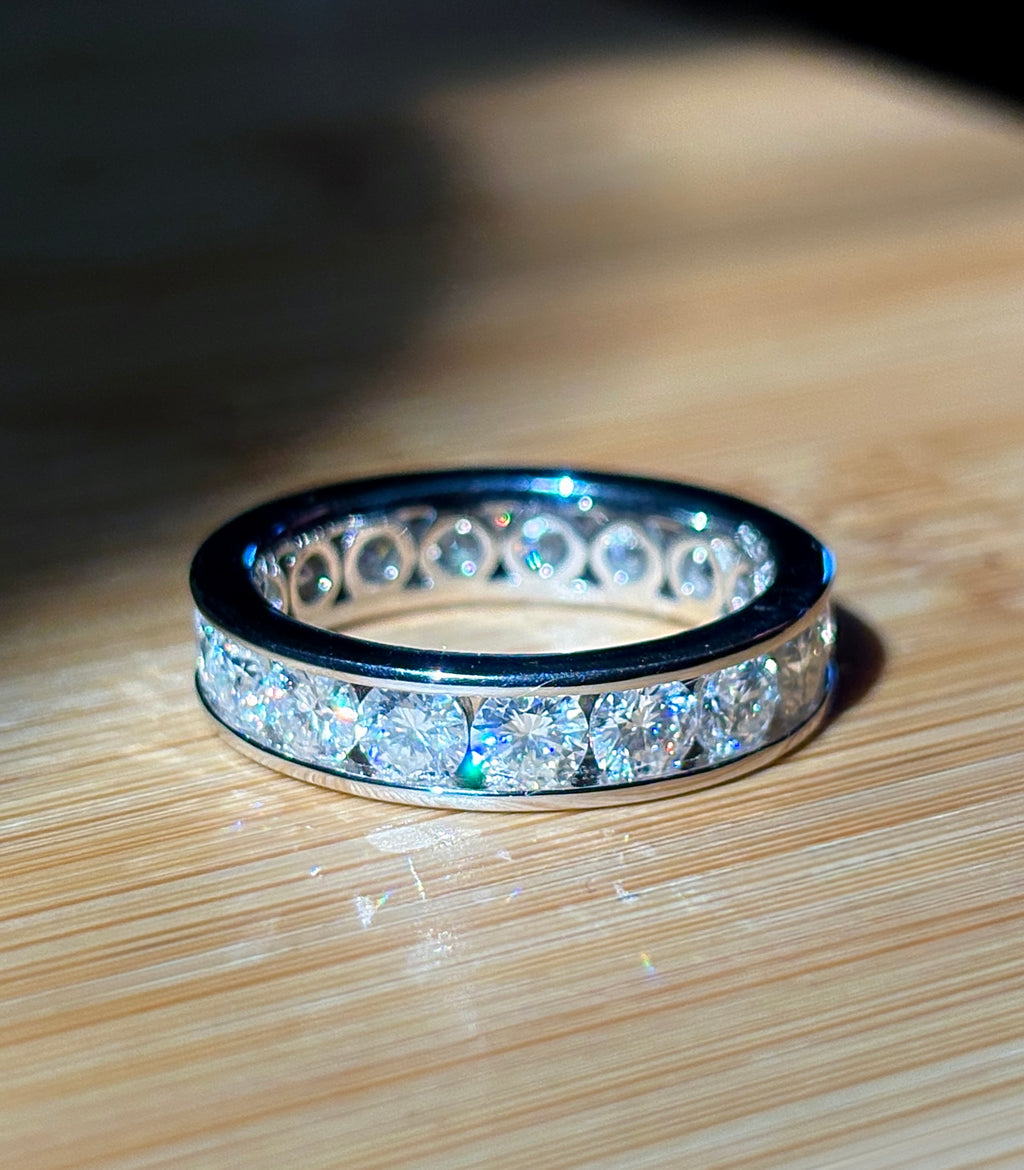 Moissanite ring. A 5.10cttw or 4.8cttw (depending on size) Moissanite eternity ring. A channel-set, classy and classic design - beautiful!