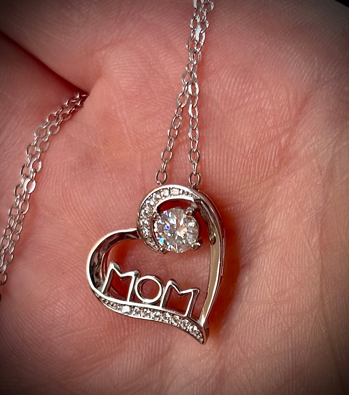 Moissanite necklace. A certified 1/2ct round radiant Moissanite in a pendant just for your mom or because you’re a mom, in sterling silver with zircon accents!
