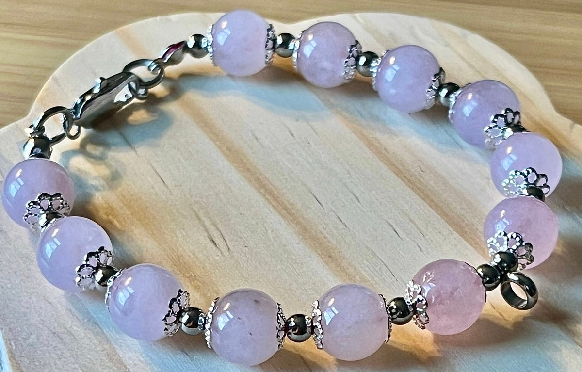 Rose quartz bracelet with 10mm Brazilian rose quartz beads and durable stainless steel components! The morganite pendant is optional.