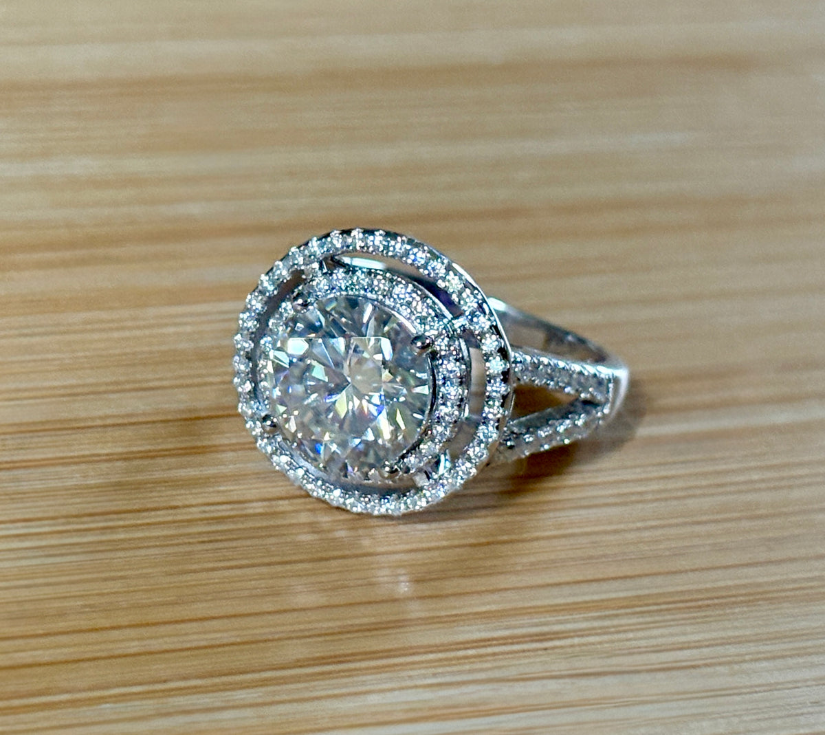 Moissanite ring. The 6.64cttw *fully* Moissanite “Bull’s Eye” ring, featuring a 4ct certified round brilliant Moissanite in a double halo!