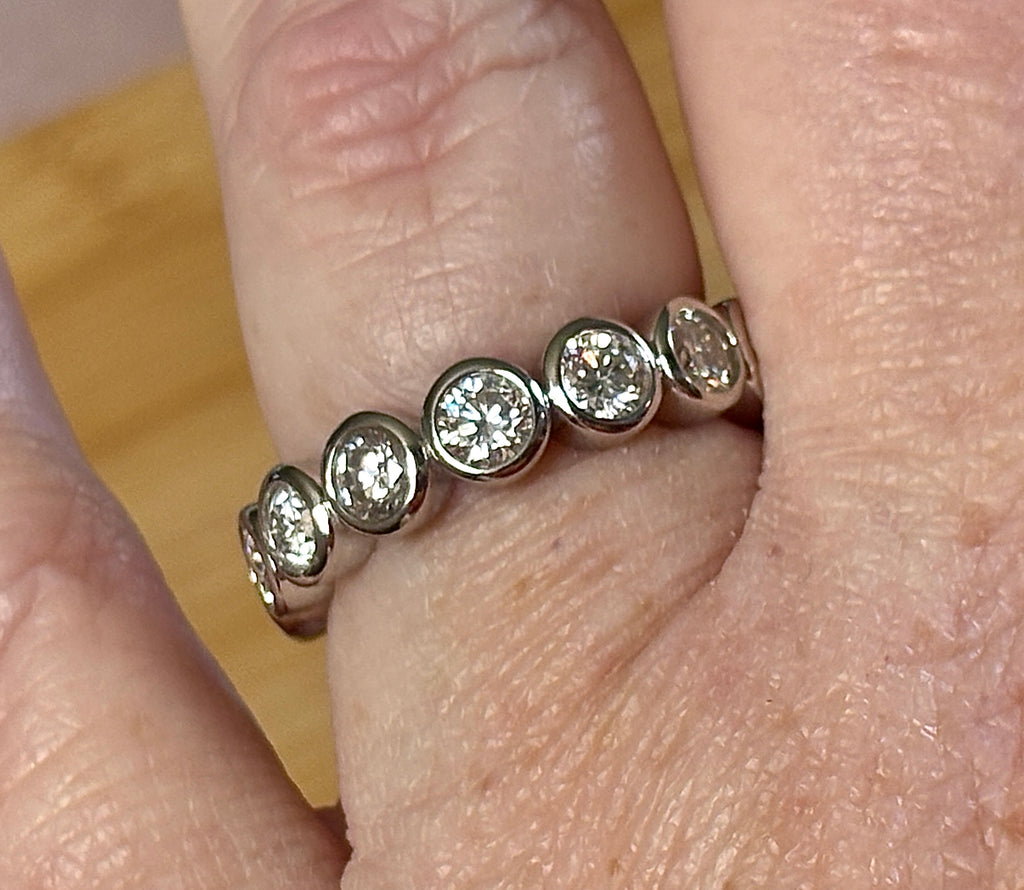 Moissanite ring. A certified, bezel-set eternity ring with 1/2ct round brilliant Moissanites set in a heavy, solid Argentium silver band!