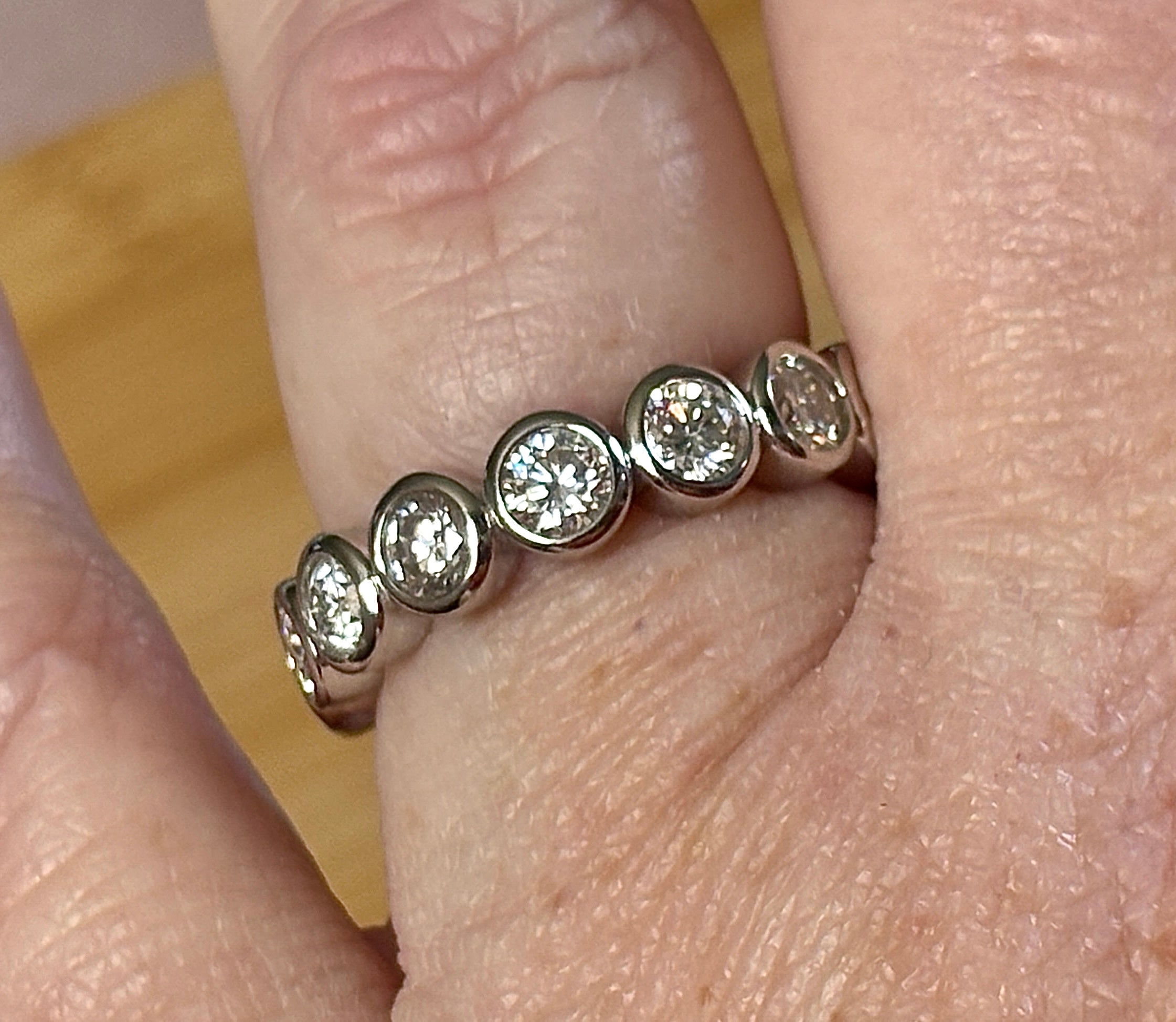 Moissanite ring. A certified, bezel-set eternity ring with 1/2ct round brilliant Moissanites set in a heavy, solid Argentium silver band!