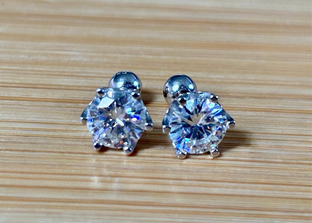 A certified pair of pretty, floral-inspired 2cttw or 4cttw Moissanite studs in poinsettia-shaped settings w/screwball backs OR 4cttw w/push backs!