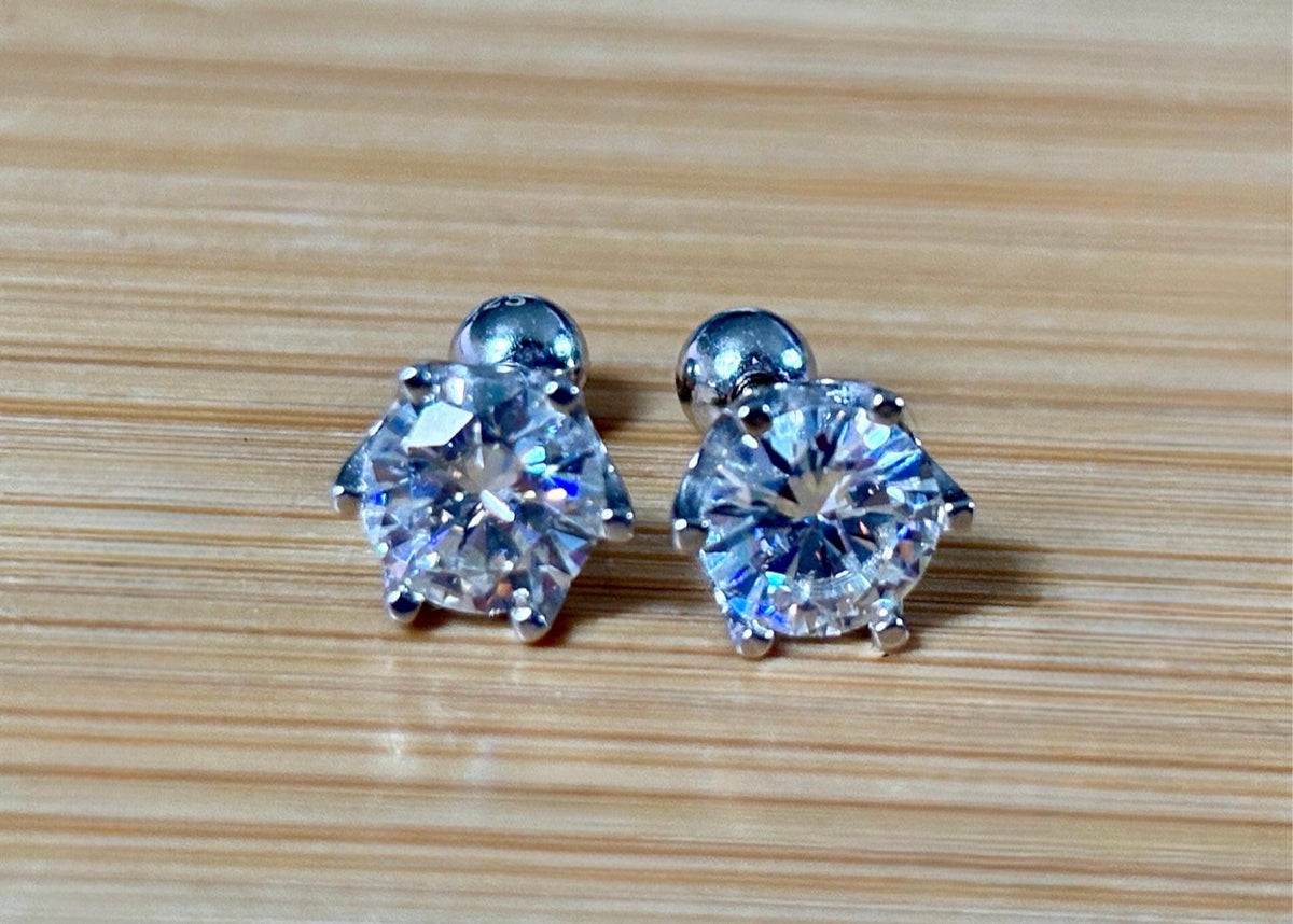 A certified pair of pretty, floral-inspired 2cttw or 4cttw Moissanite studs in poinsettia-shaped settings w/screwball backs OR 4cttw w/push backs!