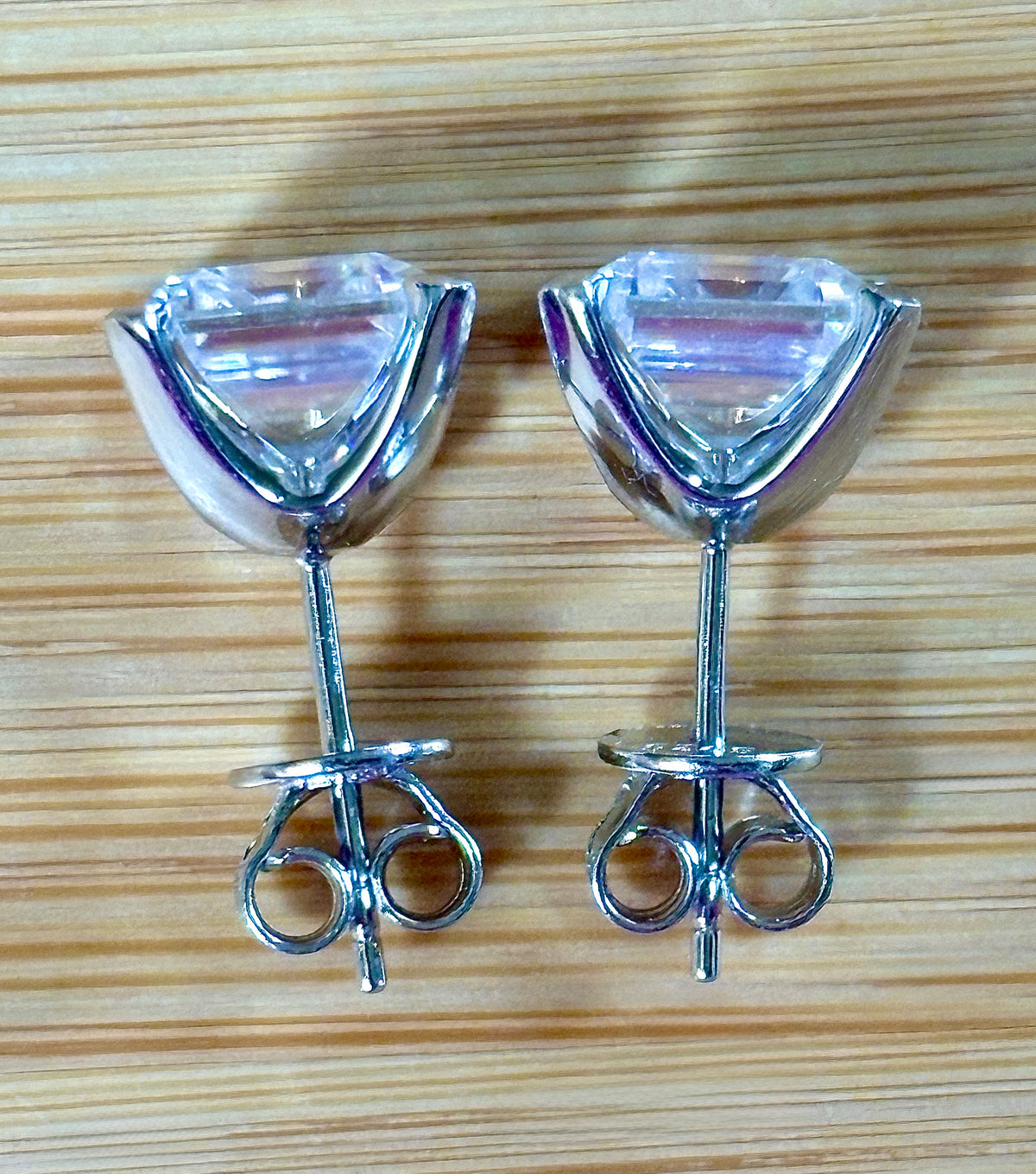 Moissanite studs. A 6.4ctw *perfect* pair of DOUBLE certified Asscher-cut Moissanites in my custom 4-claw 935 ARGENTIUM silver mountings! Opulent!