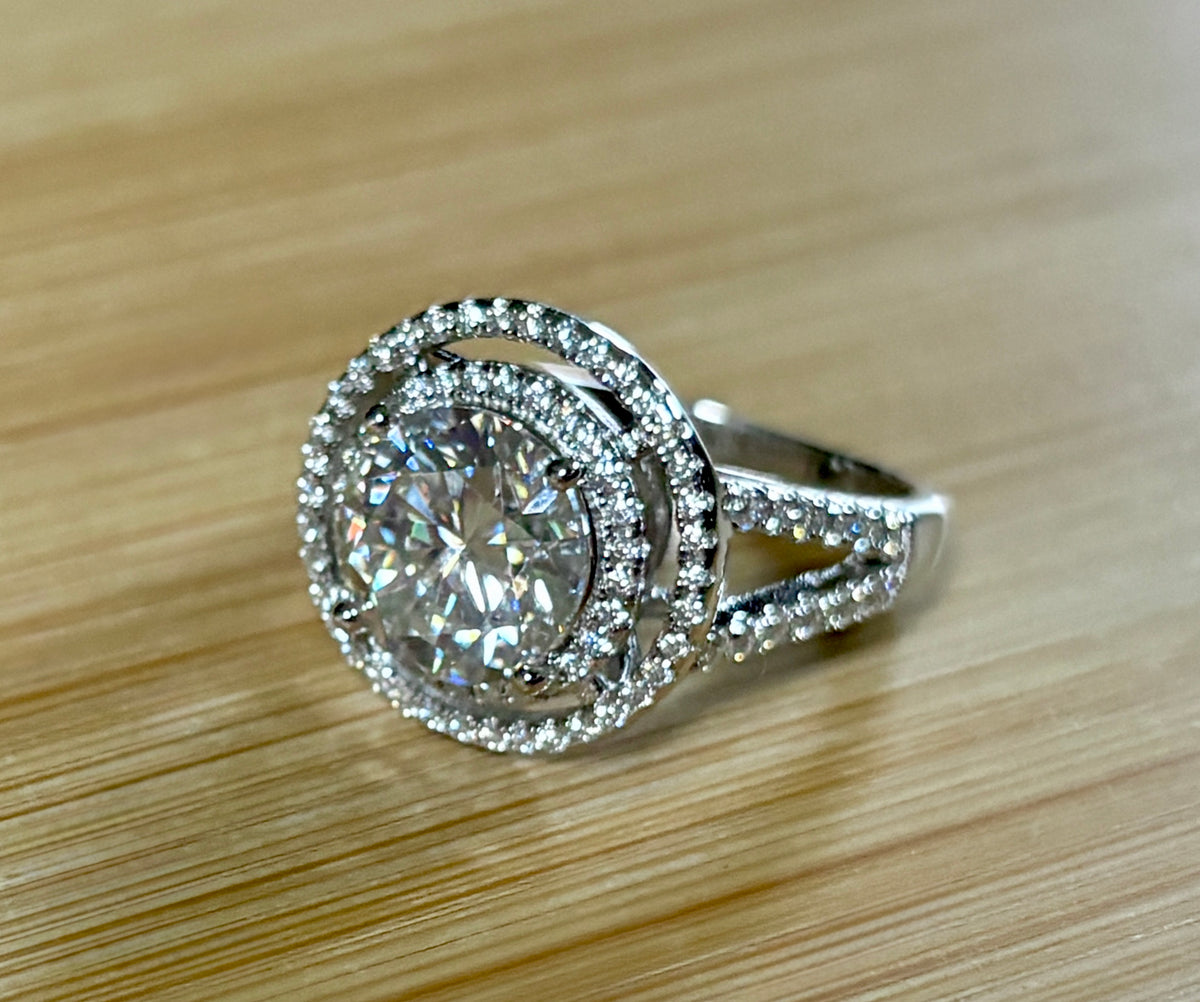 Moissanite ring. The 6.64cttw *fully* Moissanite “Bull’s Eye” ring, featuring a 4ct certified round brilliant Moissanite in a double halo!