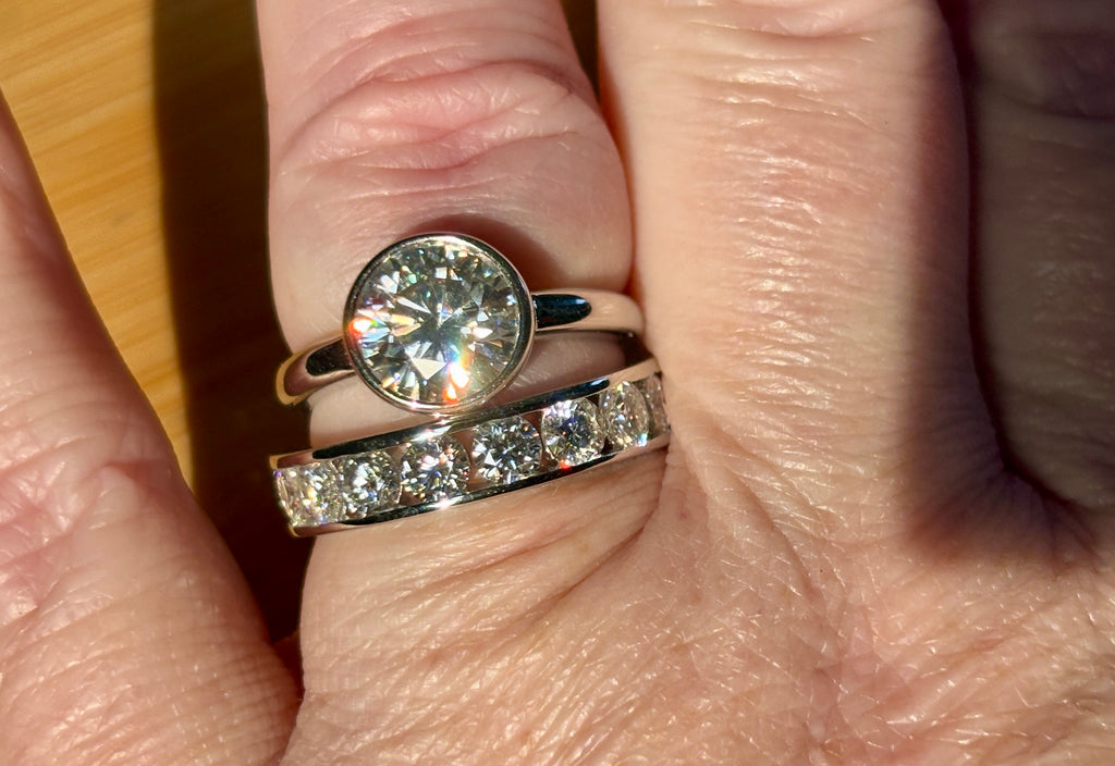 Moissanite ring. A 5.10cttw or 4.8cttw (depending on size) Moissanite eternity ring. A channel-set, classy and classic design - beautiful!