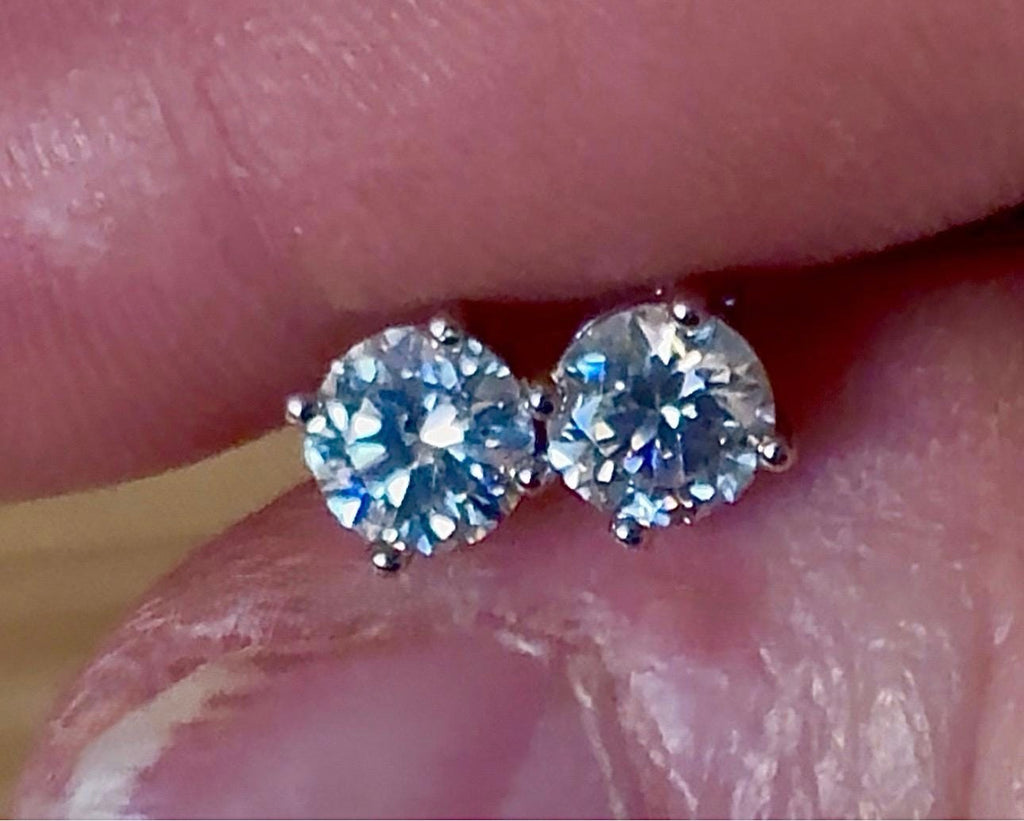 1cttw DOUBLE certified Moissanite studs with D-color and VVS1 clarity! Set in sterling silver bathed in 18k white gold, they’re a cut above!