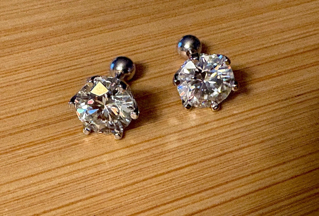 A certified pair of pretty, floral-inspired 2cttw or 4cttw Moissanite studs in poinsettia-shaped settings w/screwball backs OR 4cttw w/push backs!