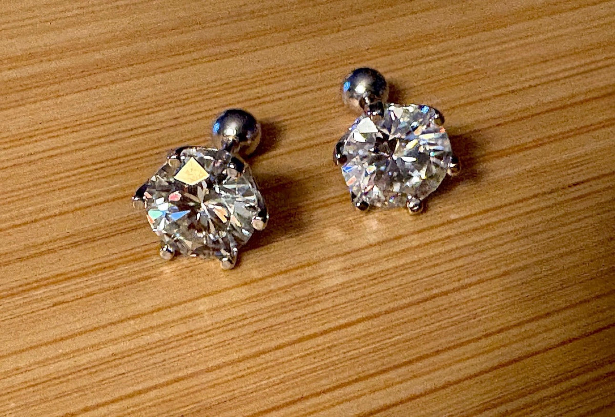 A certified pair of pretty, floral-inspired 2cttw or 4cttw Moissanite studs in poinsettia-shaped settings w/screwball backs OR 4cttw w/push backs!