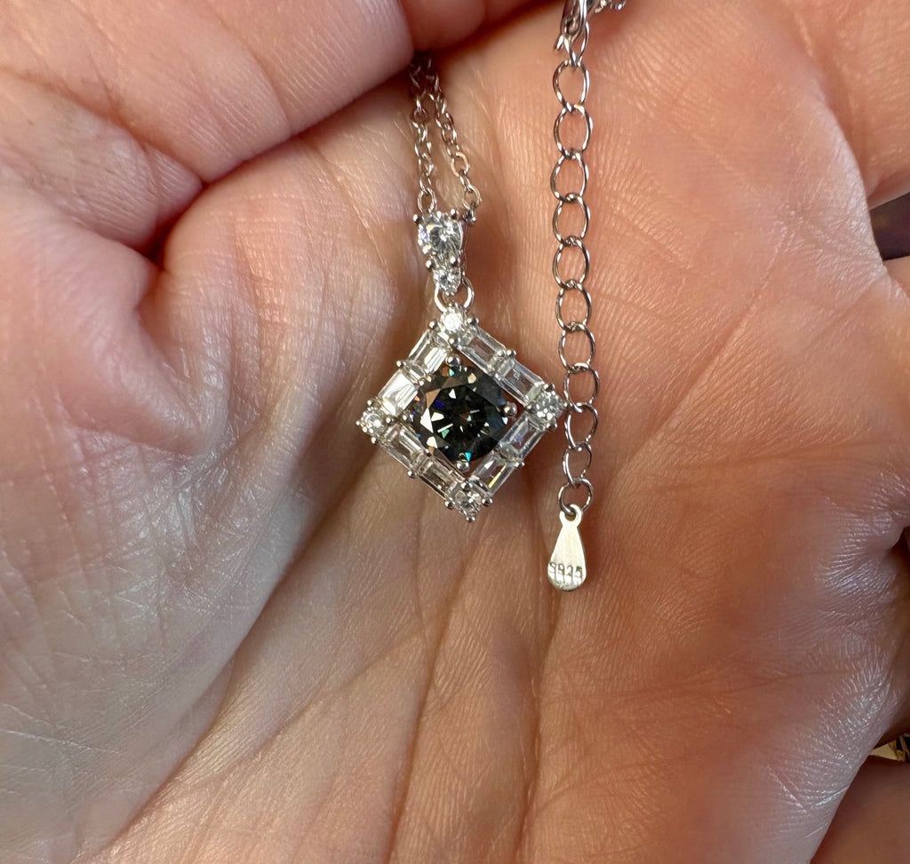 Moissanite necklace. A transfixingly gray 1ct certified round brilliant Moissanite centered in a halo of white zircons - a 2.25cttw pendant!