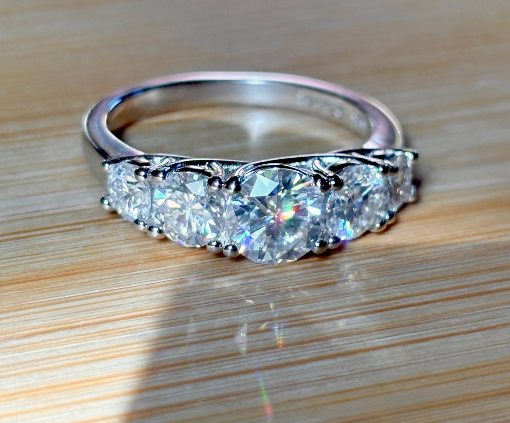 Moissanite ring. A 2.5ctw certified Moissanite ring, for those who want plenty of sparkle but a daintier ring! This feminine 5-stone design is just the thing!