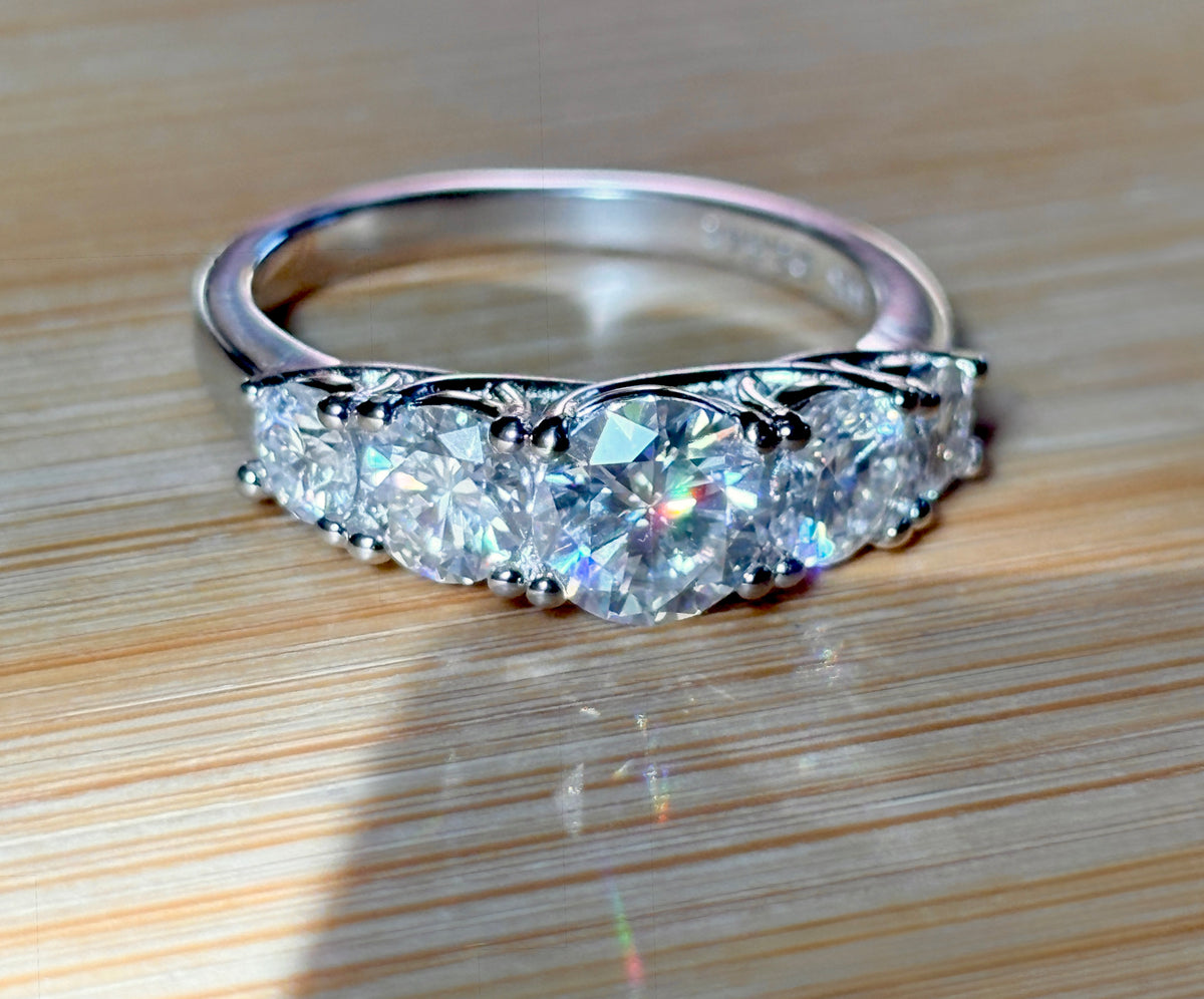 Moissanite ring. A 2.5ctw certified Moissanite ring, for those who want plenty of sparkle but a daintier ring! This feminine 5-stone design is just the thing!