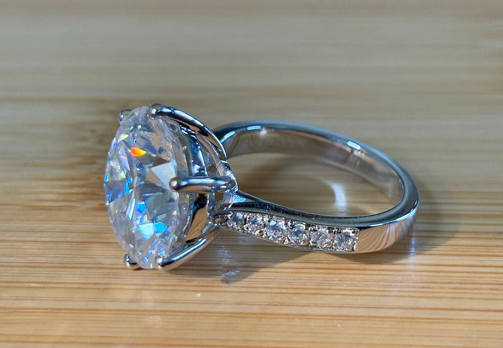 Moissanite ring. The 10ct certified 8H8A Moissanite “Tulip” statement ring with .50cttw Moissanite accents! Photos fail this GORGEOUS ring!
