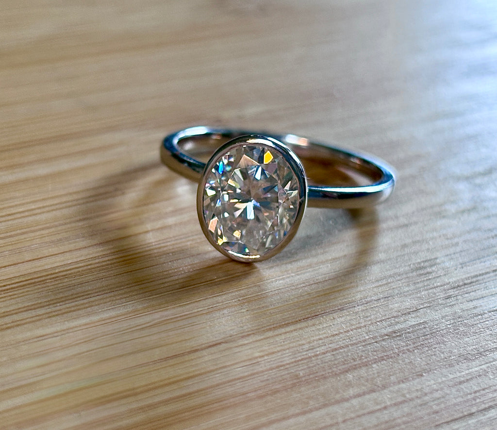 Moissanite ring. A 3ct oval in a hybrid basket + bezel of sterling OR Argentium silver! A Hand Knotted Jewelry EXCLUSIVE!