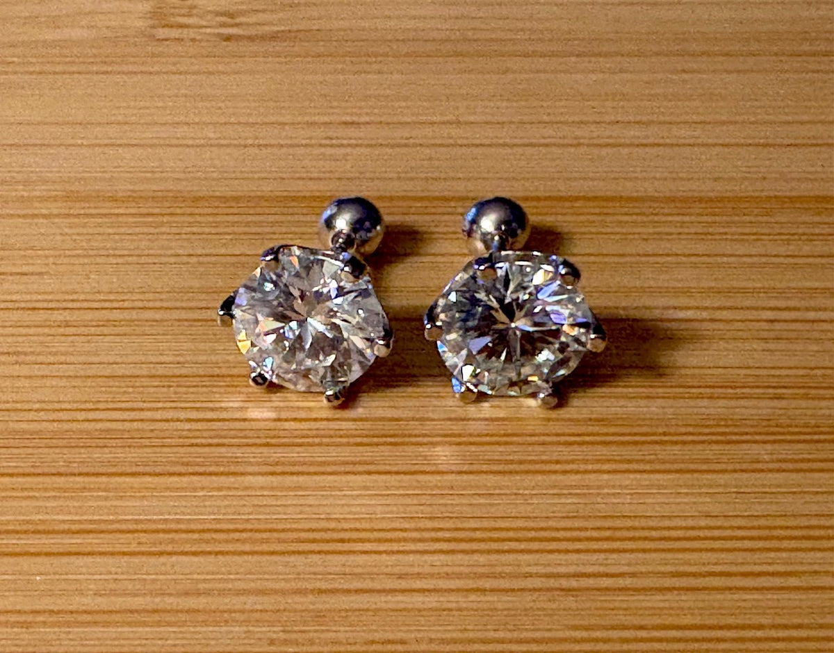 A certified pair of pretty, floral-inspired 2cttw or 4cttw Moissanite studs in poinsettia-shaped settings w/screwball backs OR 4cttw w/push backs!