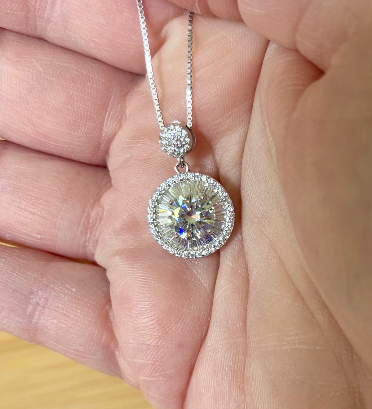 Moissanite necklace. The certified 2ct Moissanite “Sunburst” necklace with a 61 gemstone pendant plus more in the bail! Radiantly beautiful!