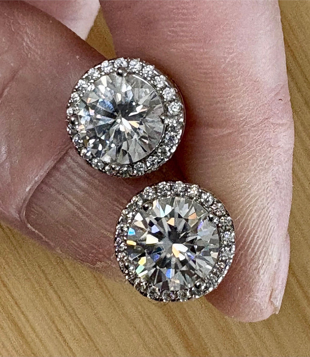 Moissanite earrings. A glittering 5.44cttw pair of certified Moissanites and white zircons in 18k gold-embraced sterling silver! Perfection!