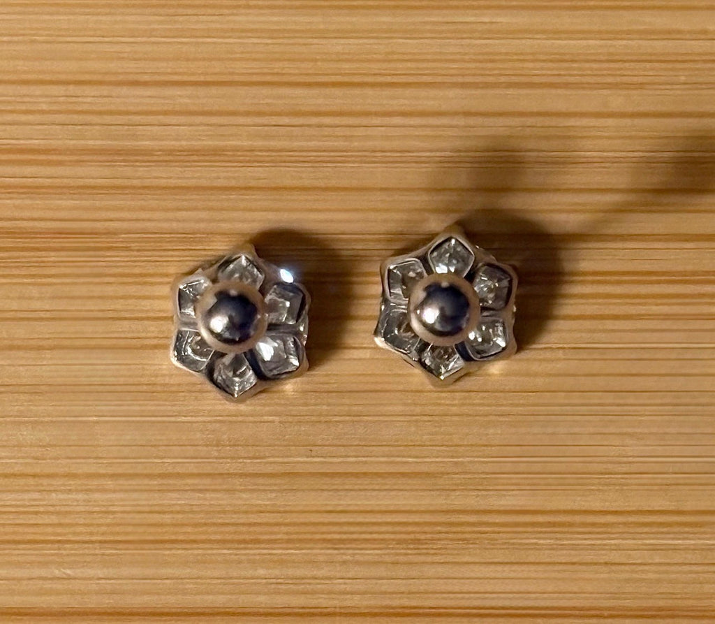 A certified pair of pretty, floral-inspired 2cttw or 4cttw Moissanite studs in poinsettia-shaped settings w/screwball backs OR 4cttw w/push backs!