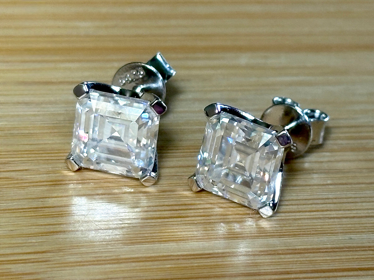 Moissanite studs. A 6.4ctw *perfect* pair of DOUBLE certified Asscher-cut Moissanites in my custom 4-claw 935 ARGENTIUM silver mountings! Opulent!