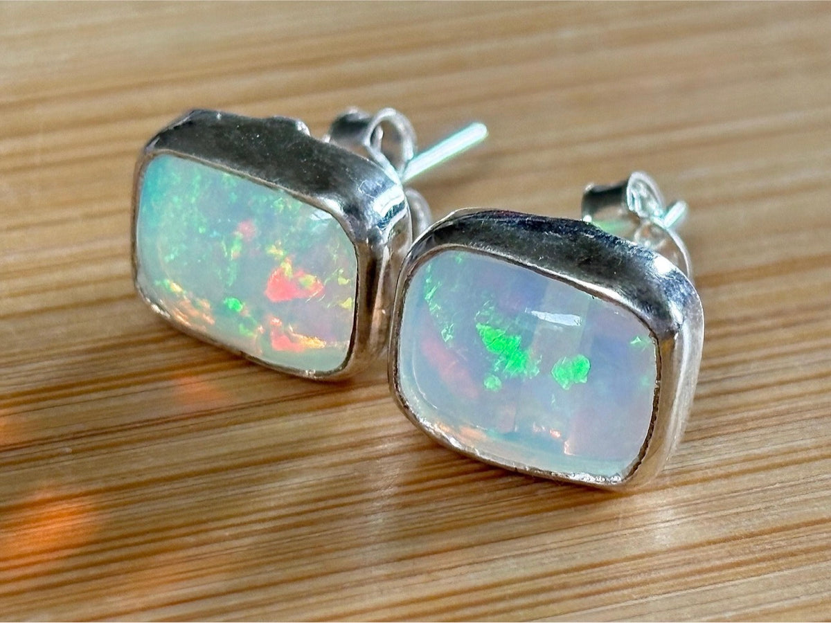 Ethiopian opal earrings, pair B. A beautiful pair of rectangular Ethiopian opal earrings, approximately 4cttw and hand-set in sterling silver bezels!
