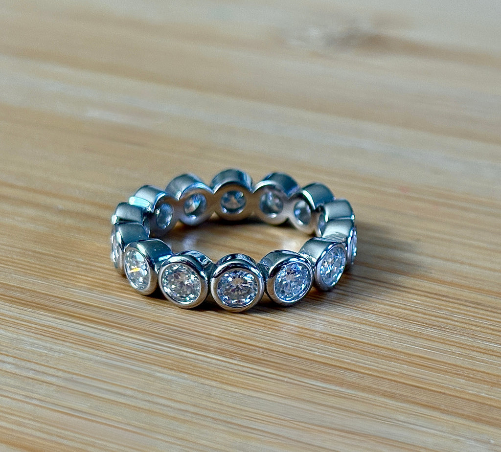 Moissanite ring. A certified, bezel-set eternity ring with 1/2ct round brilliant Moissanites set in a heavy, solid Argentium silver band!