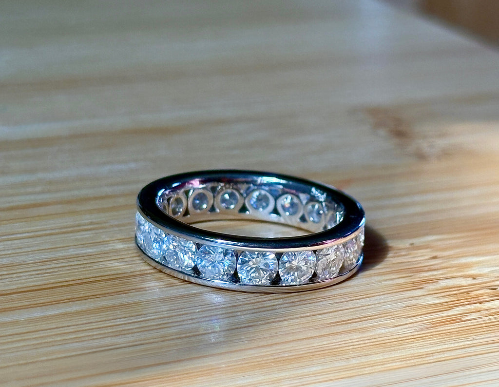 Moissanite ring. A 5.10cttw or 4.8cttw (depending on size) Moissanite eternity ring. A channel-set, classy and classic design - beautiful!