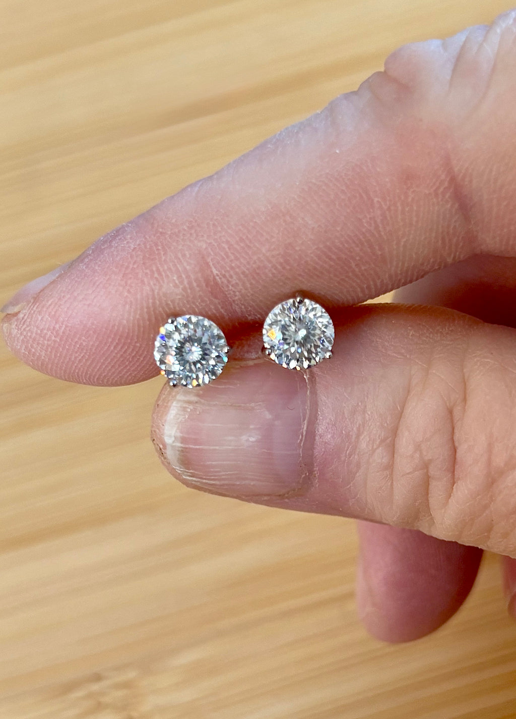 Moissanite studs. A 100-facet 2cttw pair of super bright, DOUBLE certified Moissanite studs in sterling silver and 18k white rhodium! Sublime!