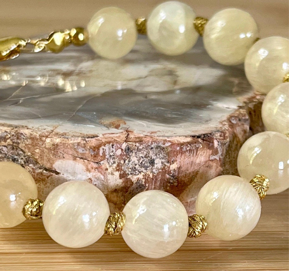 Silky yellow quartz bracelet. Chatoyant 10mm buttercream quartzite (AKA silk jade) hand-knotted bracelet with METALLIC string!