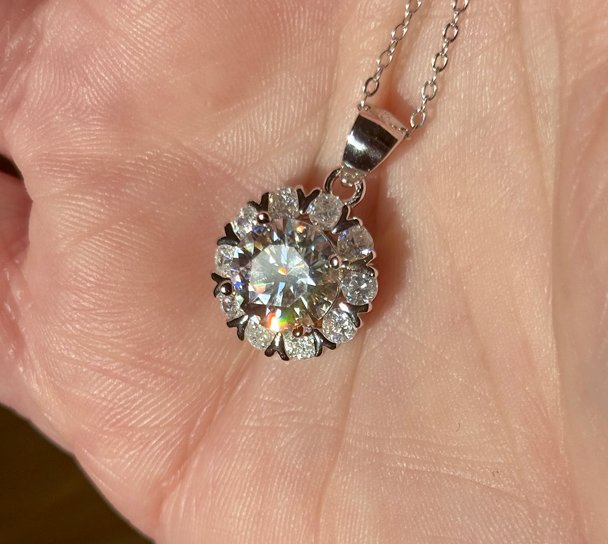 Moissanite necklace. A 3ct certified round brilliant Moissanite in a snowflake-shaped pendant ! A perfect piece for the holidays and beyond!