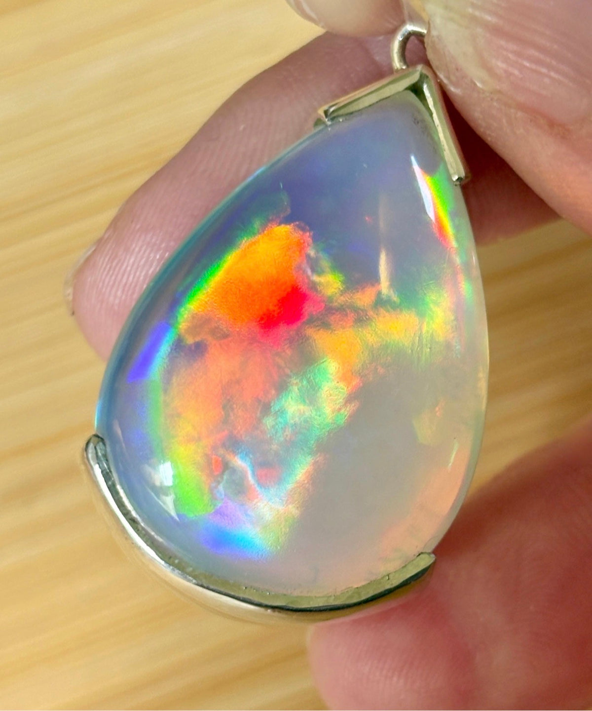 The “After the Storm” Ethiopian opal pendant, 39.18ct with rare “rolling” fire and spectacular play of color! **Collector’s grade** AAAA++