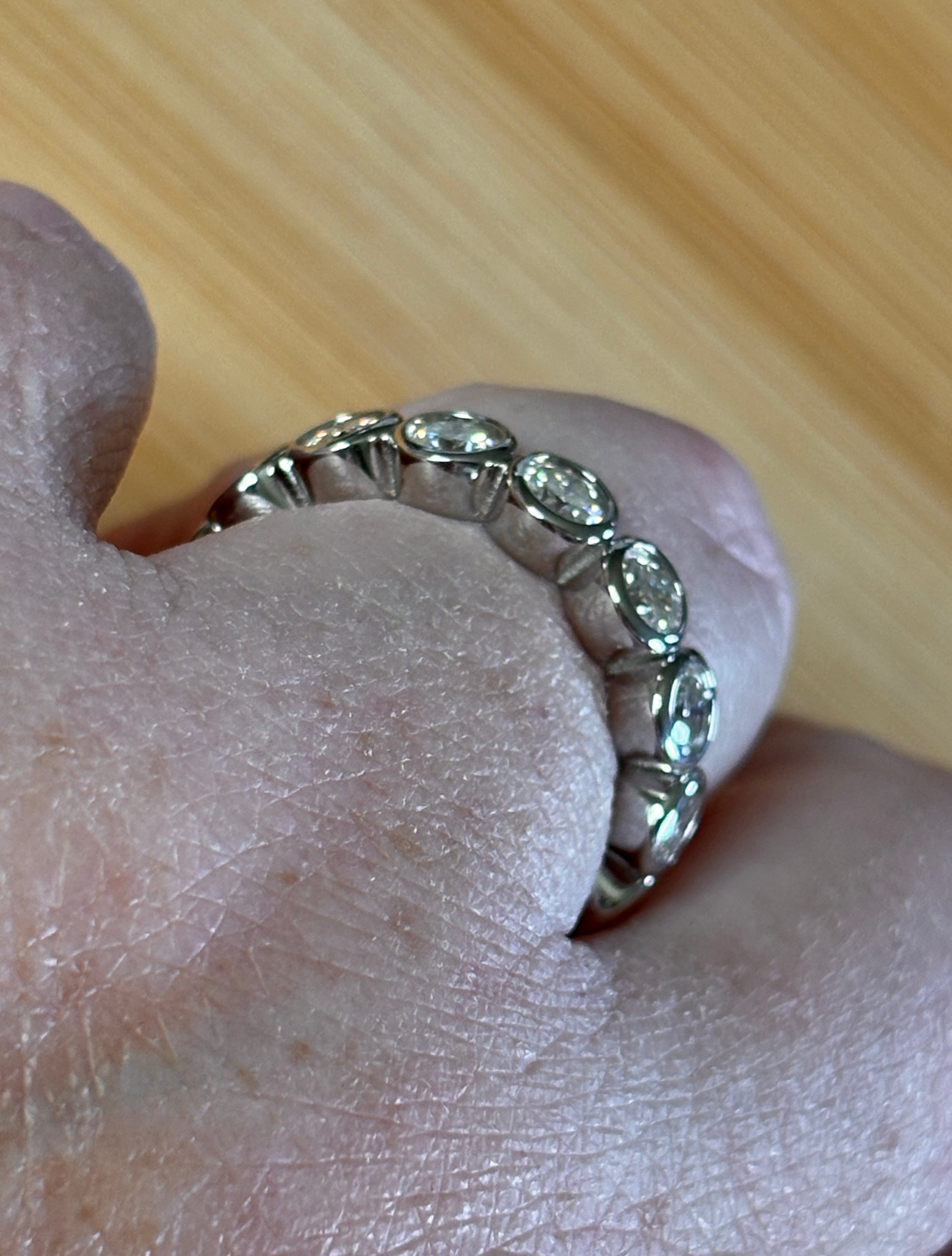Moissanite ring. A certified, bezel-set eternity ring with 1/2ct round brilliant Moissanites set in a heavy, solid Argentium silver band!