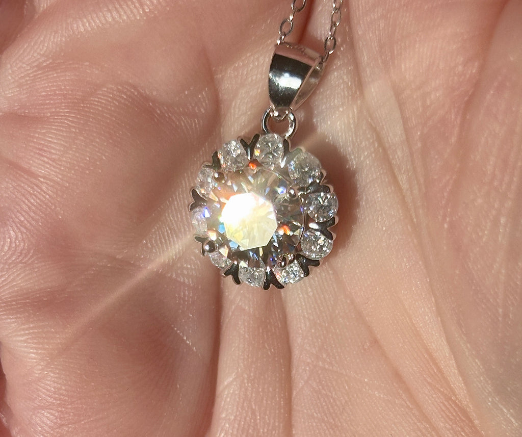 Moissanite necklace. A 3ct certified round brilliant Moissanite in a snowflake-shaped pendant ! A perfect piece for the holidays and beyond!