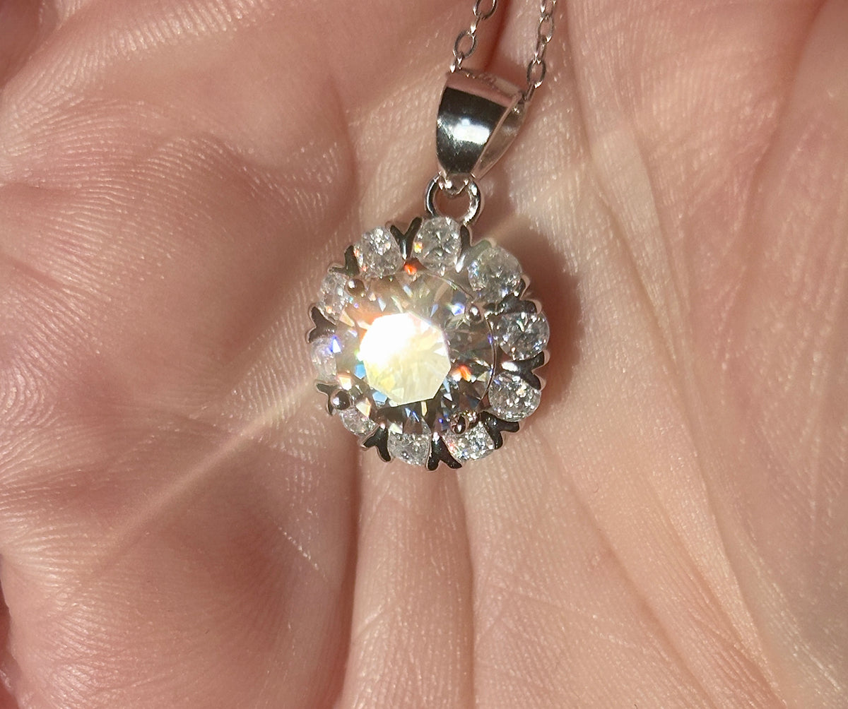 Moissanite necklace. A 3ct certified round brilliant Moissanite in a snowflake-shaped pendant ! A perfect piece for the holidays and beyond!