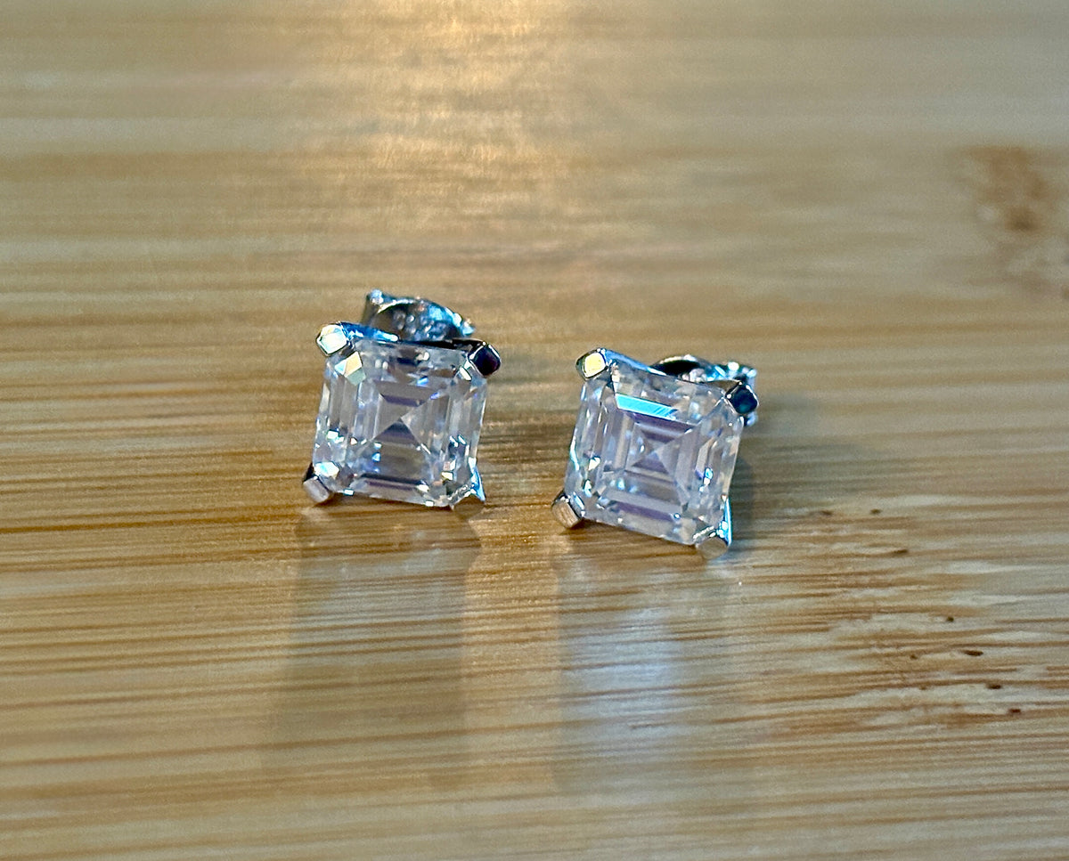 Moissanite studs. A 6.4ctw *perfect* pair of DOUBLE certified Asscher-cut Moissanites in my custom 4-claw 935 ARGENTIUM silver mountings! Opulent!