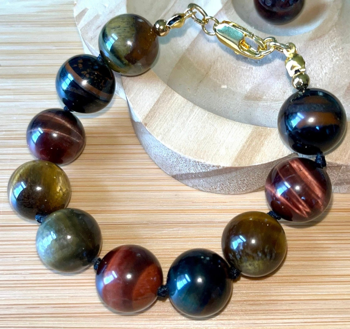 Tiger’s eye bracelet. 100% natural, highly chatoyant 14mm tricolored tiger’s eye hand knotted bracelet! Also available without the knots!