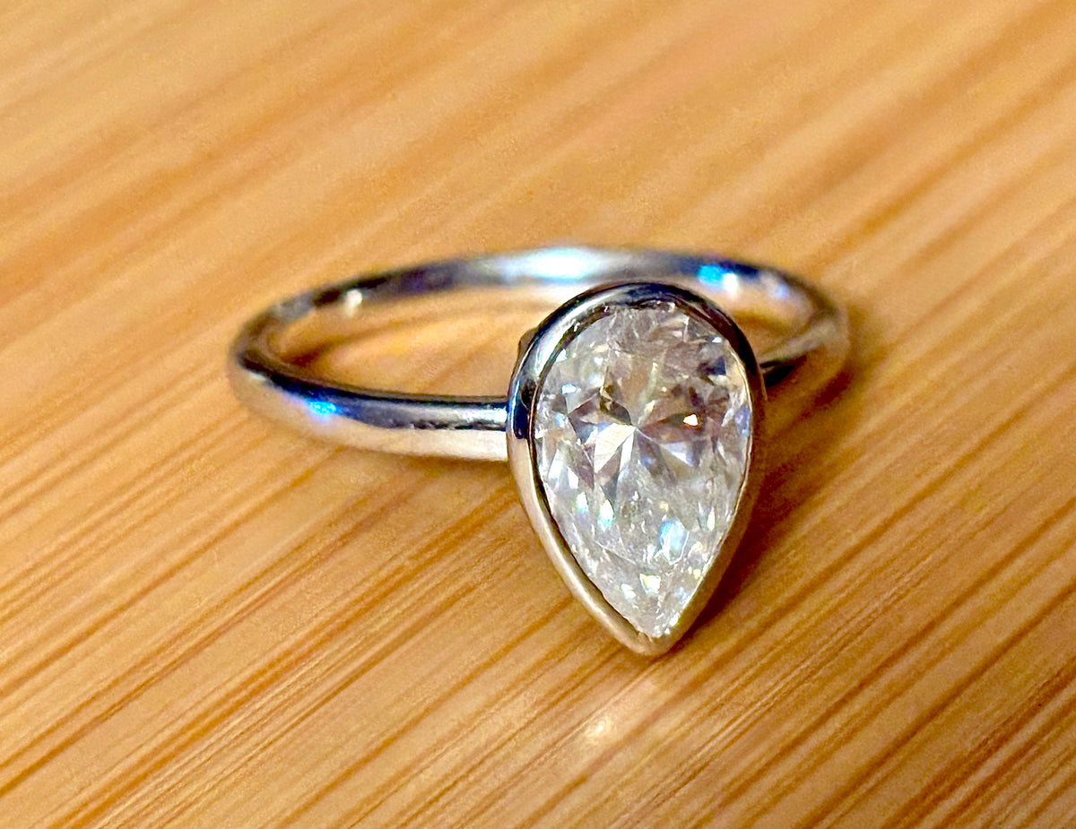 Moissanite ring. A certified 3ct pear in a hybrid basket + bezel of 925 sterling or 935 Argentium silver! A Hand Knotted Jewelry EXCLUSIVE!