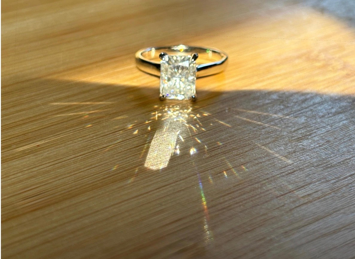 A certified Moissanite 3ct radiant solitaire! An UBER flashy, ULTRA classy, contemporary and chic radiant-cut engagement ring!