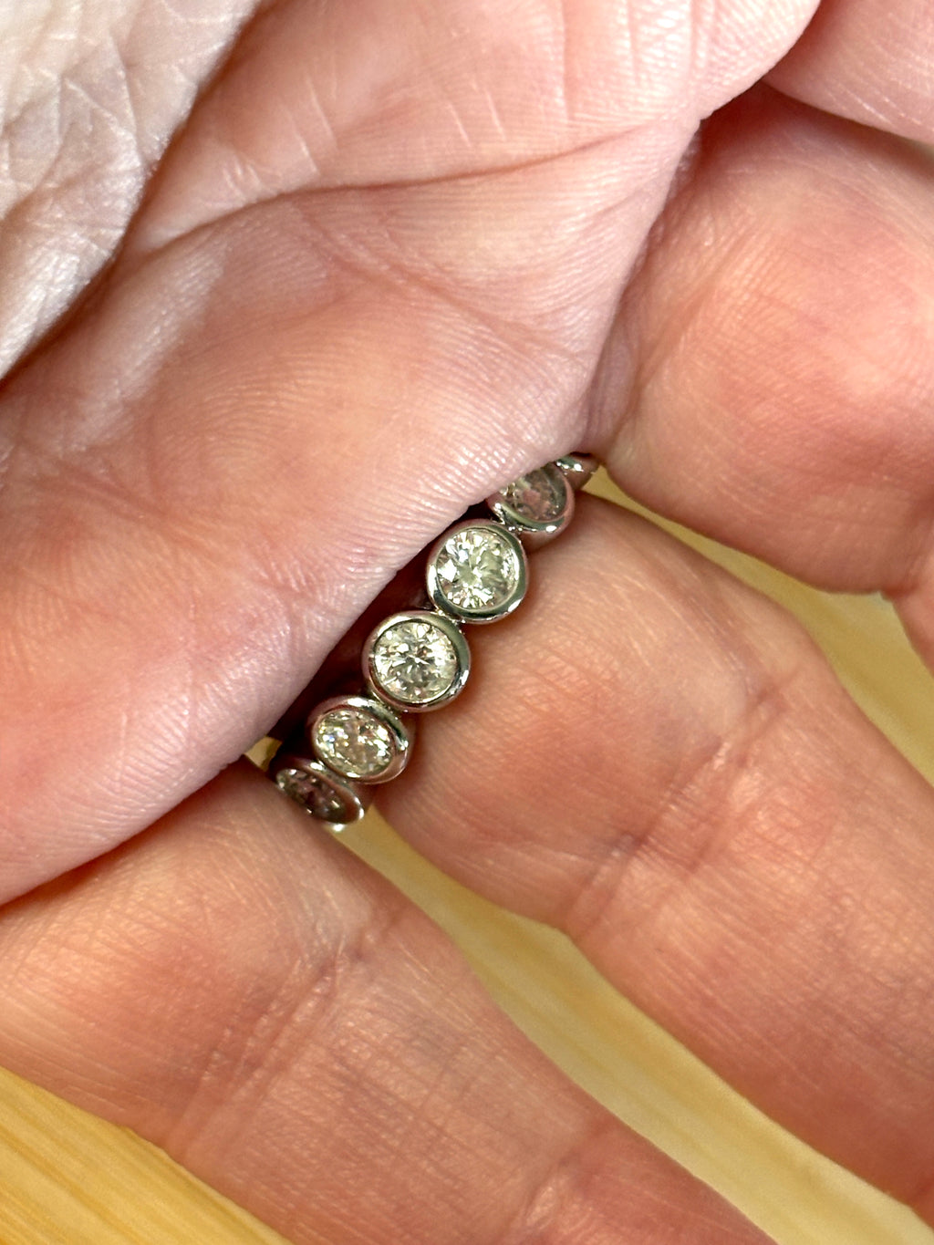 Moissanite ring. A certified, bezel-set eternity ring with 1/2ct round brilliant Moissanites set in a heavy, solid Argentium silver band!