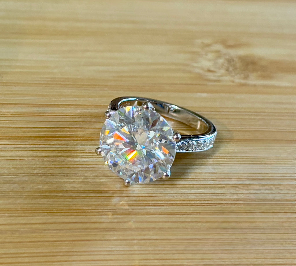 Moissanite ring. The 10ct certified 8H8A Moissanite “Tulip” statement ring with .50cttw Moissanite accents! Photos fail this GORGEOUS ring!
