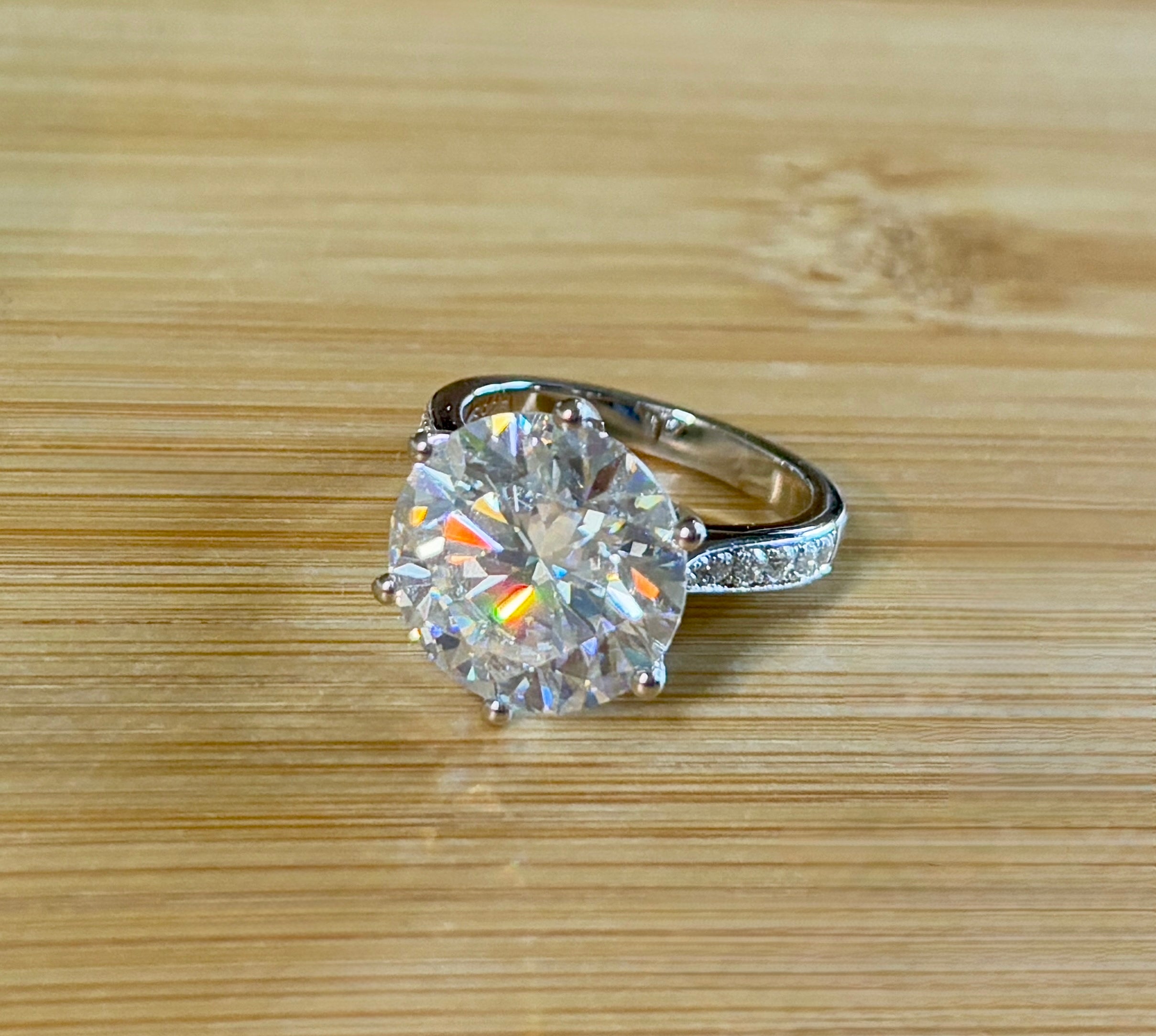Moissanite ring. The 10ct certified 8H8A Moissanite “Tulip” statement ring with .50cttw Moissanite accents! Photos fail this GORGEOUS ring!