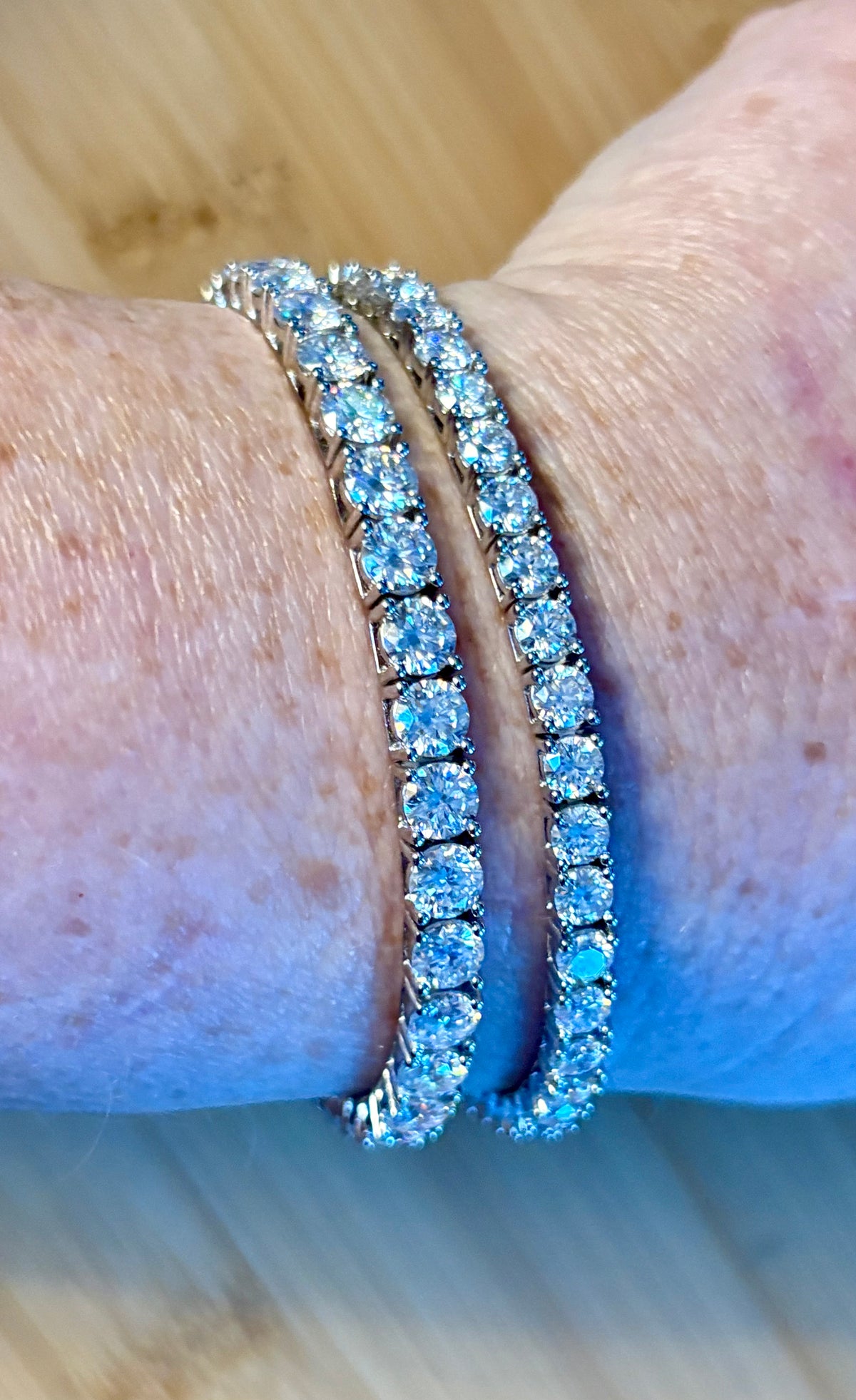 The certified “Ultimate Moissanite Tennis Bracelet” with masterful construction and “invisible” clasp in Argentium OR sterling silver!