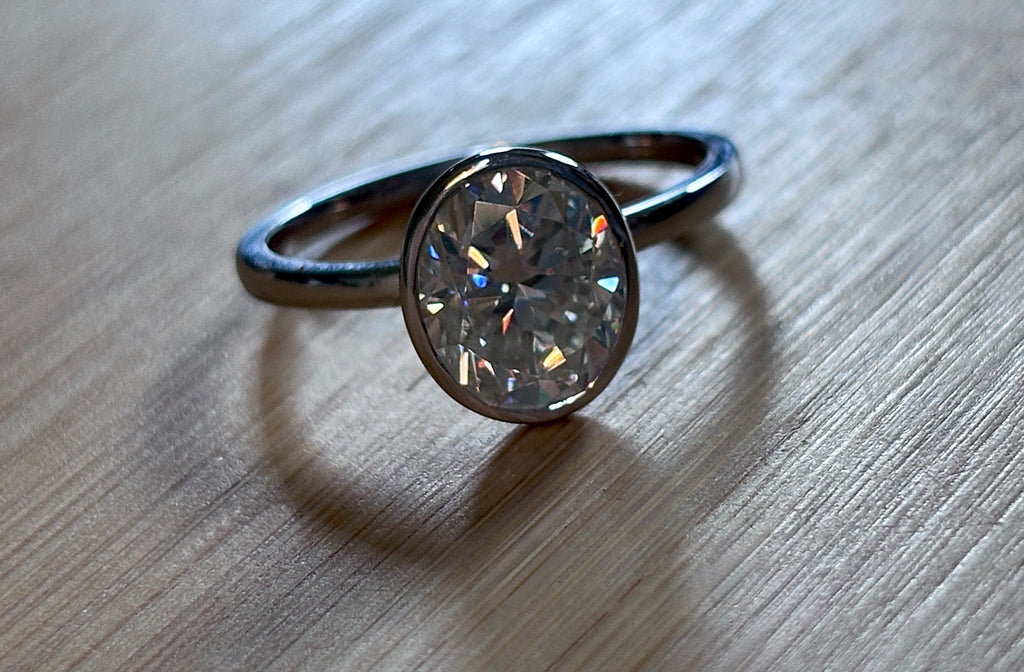 Moissanite ring. A 3ct oval in a hybrid basket + bezel of sterling OR Argentium silver! A Hand Knotted Jewelry EXCLUSIVE!