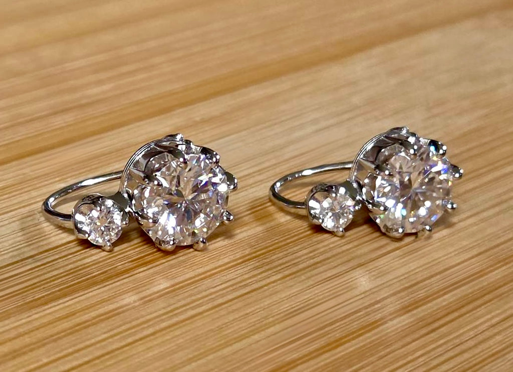 A Victorian inspired 4.2cttw certified pair of Moissanite 2-stone buckle back earrings in Argentium silver! Minimalist glam!