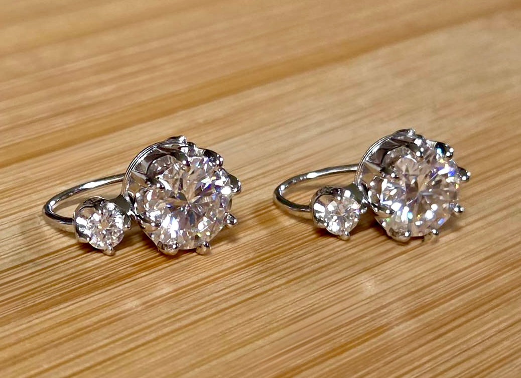 A Victorian inspired 4.2cttw certified pair of Moissanite 2-stone buckle back earrings in Argentium silver! Minimalist glam!